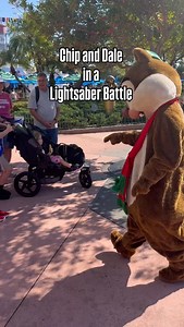 Chip and Dale - adorned in their Christmas hats - participated in an Air Lightsaber Battle…Dale even recruited a family 😂 Just because it’s the holiday season doesn’t mean that one can’t have a festive galaxy fight in Disney’s Hollywood Studios 🎄 🌌 #chipanddale #starwars #disneychristmas @disneyparks @waltdisneyworld | Doctor Disney