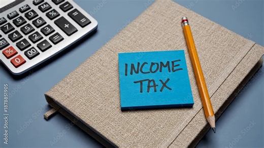 Notebook With Finance Reminder, Reminder Note On Income Tax Placed Beside Calculation Tools, Scene Showing Handwritten Income Tax Note Adjacent To Calculator And Writing Instruments