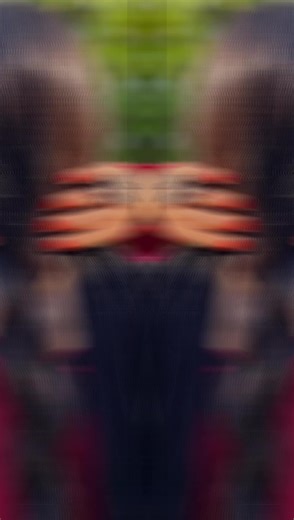 Young Woman in Traditional Outfit with Red Rose