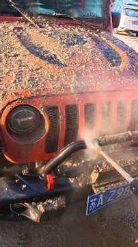 Mud-Covered Jeep After Extreme Off-Road AdventureDirty Jeep Wrangler Covered in Mud –Off-Road Action