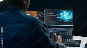 AI professional in home office using laptop to write programming language code. Artificial intelligence engineer working from home using notebook device to build application, camera A