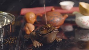 Chinese traditions. Toad in the tea ceremony.