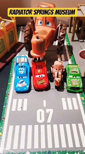 Pixar Cars Giant Tractor on the same racetrack as Lightning McQueen Chick Hicks The King .