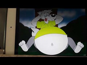 big belly wolf relaxing under the tree