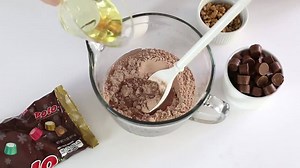 Chewy, fudgey brownies filled with chocolate, caramel, and nuts! The perfect holiday dessert! | HERSHEY'S