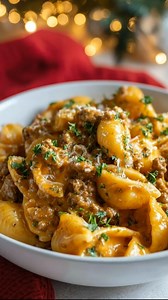 Ultimate Cheesy Beef Shell Pasta Ingredients: 1 lb (450g) ground beef 1 tbsp olive oil 1 small onion, diced 2 cloves garlic, minced 1 tsp salt ½ tsp black pepper 1 tsp Italian seasoning ½ tsp smoked paprika 2 cups medium pasta shells (uncooked) 1 can (15 oz) tomato sauce 1 can (14.5 oz) diced tomatoes (drained slightly) 1 cup beef broth 1 cup shredded cheddar cheese 1 cup shredded mozzarella cheese ½ cup cream cheese (cubed and softened) Fresh parsley or basil for garnish (optional) Instructions