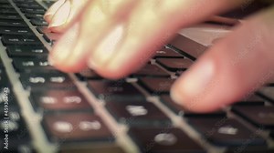 Touch typing close up. Fingers press the buttons of the laptop keyboard, close-up. Ten-fingered blind method of typing on the keyboard.