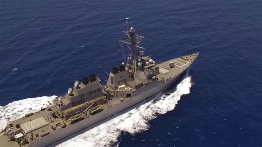 Chinese aircraft buzzes American warship in contested South China Sea zone