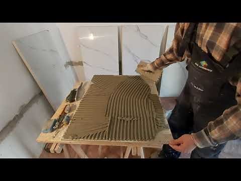 Cutting and setting a ceramic tiles of 60 x 120 cm with vacum grippers