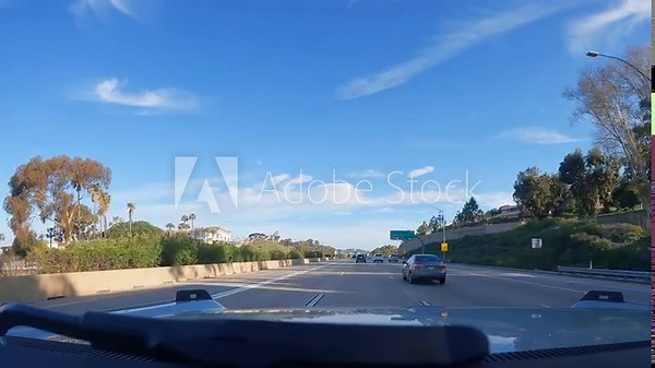 Los Angeles, California USA - 08 18 2023 : Driving on intercity freeway in California USA. Defocused view from car thru glass windshield. Blurred suburb multiple lane driveway. Camera inside auto Stock Video
