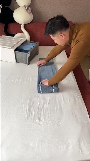 Listen to a familiar melody 🎵 and watch a heart-throbbing pants folding method #organizer #storage