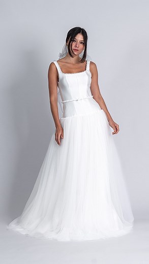 ✨ Lilia Wedding Dress & Shanna Veil ✨ A vision of romance and elegance. The Lilia Wedding Dress features a drop-waist design with a structured bodice, square neckline, and delicate pearl embellishments, creating a refined silhouette. Paired with the Shanna Veil, with its cascading ruffle edges, this look is effortlessly ethereal—perfect for the modern bride who loves timeless charm. 💍 Available to order in Sydney & online! Book your appointment or shop now. #LiliaWeddingDress #ShannaVeil #DropW