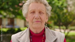 Senior portrait, retirement garden and woman in nature during summer, with fashion clothes and gardening in natural urban park. Face of elderly person in happiness in city with spring background