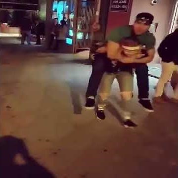 Small girl lift carry piggyback man twice her size