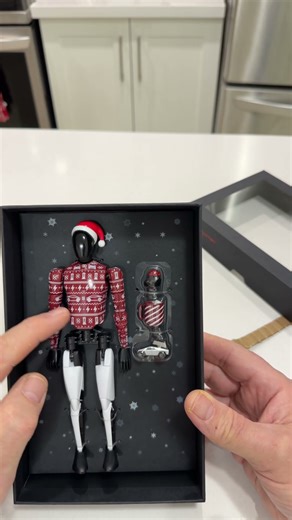 Did Tesla Just Drop the Coolest Holiday Toy Ever?! Tesla Bot Holiday Edition
