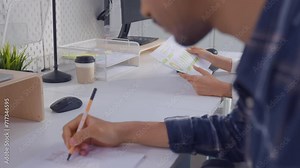 Young attractive businessman and businesswoman work in office workplace.