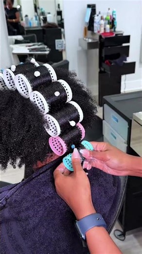 We choose the roller set method to stretch the hair before a silk press