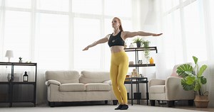 Woman Doing Jumping Jacks Exercise At Home Stock Footage SBV-336498448 - Storyblocks