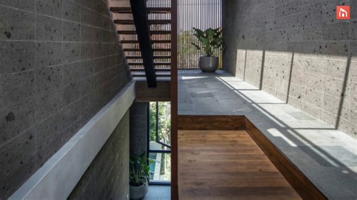 Modern house in Bali incorporates the lush topography into its design