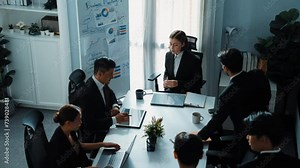 Business people sitting at seat and prepare for meeting at whiteboard with colorful sticky notes and mind map. Professional diverse group talking about marketing plan at meeting room. Directorate.