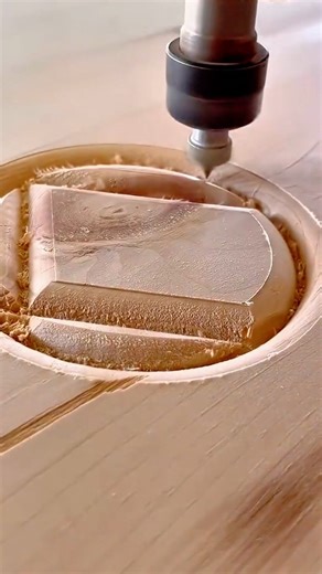 CNC router machine is precisely carving a circular design into a wood block