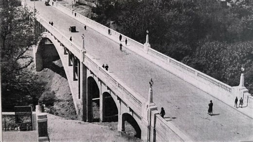 The Glen Bridge brought to life from it's early days. The Glen Bridge in Dunfermline is a significant 20th-century structure, notable for its architecture and historical importance to the town's transport. The Glen Bridge was built between 1930 and 1932 and is a Category B listed reinforced concrete bridge featuring distinctive Art Deco design elements, such as balustraded parapets and geometric lamp standards. The bridge was designed by D.H. Shaw, Burgh Engineer, in collaboration with F.A. MacD