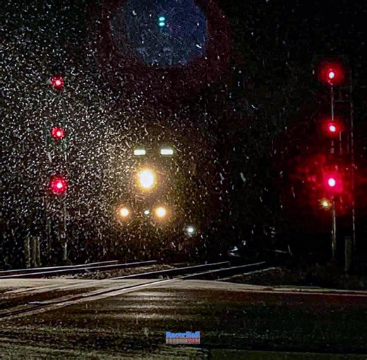 A typical scene I admire most are nights of what I call “deep winter”: The streets are quiet, the lights from lampposts and gas stations illuminate the fallen snow and the salt-bitten pavement, and moisture from snowfall magnifies the red displays on the train signals. The silence of red signals in the snowfall was broken with a green signal given for Eastbound CSX Train D906-18 for a chance to slingshot through the junction and rock Plymouth’s Old Village District with the loud rumble of 2 loco