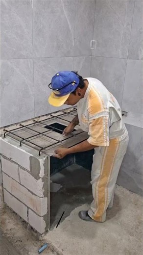 Cut the space under the tub. Grinding the edge of 45°. Install and prepare cement next. #viral #diy