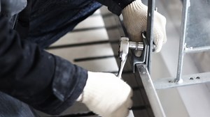 Worker To Tighten The Screws