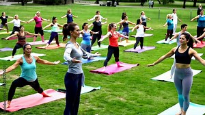 Outdoor yoga class in the park with participants practicing poses together
