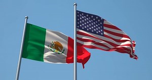 Mexico and USA flag on flagpole. 4K 60fps. Mexican and American Flag in Slow Motion. The United Mexican States flag and the United States of America flag waving in wind. Great for History, presentatio