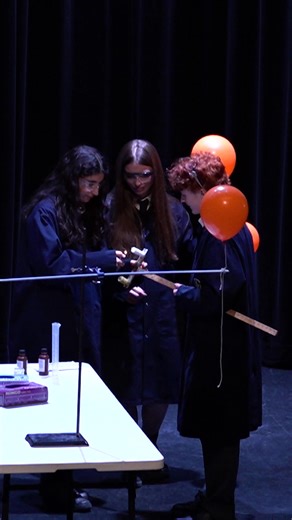 Our Chem Club took the stage at assembly with live, on-stage chemical reaction demonstrations, impressing the audience with colour, energy, and a little bit of wow-factor science. With their exciting reactions, the team sparked interest and encouraged students to sign up and get involved. Think you’ve got the curiosity (and courage) to experiment? Join Chem Club! -- Notre Club de chimie est monté sur scène pour présenter des démonstrations de réactions chimiques, impressionnant les spectateurs a