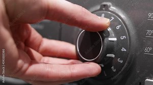 Person twisting the dial on the interface of a silver washing machine. Still shot. Stock Video