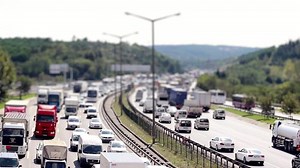 Download Heavy highway traffic, cars moving on highway, selective focus, noise effect, time lapse for free