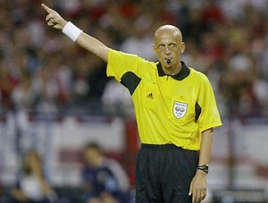 Why do football referees wear black or yellow?