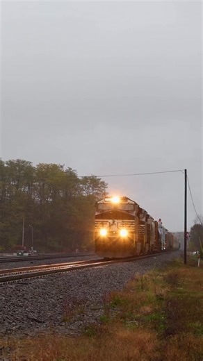 In the pouring rain a westbound manifest train runs through Cresson with a pair of transformers on depressed flat cars, which is a pretty neat catch if you ask me! #railroad #railway #train #drone #rail #reels #reelsvideo #october #fall #rain #moody #mood | Craig Hensley Photography