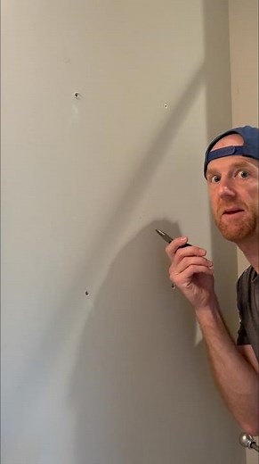How to remove a stuck drywall anchor spinning in the wall. #homerepair #diyhome #drywall