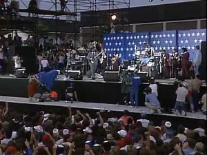 B.B. King casually restrings guitar during performance.