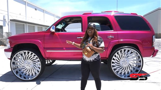 Candy magenta pink Chevy Tahoe on 34” ASANTI wheels