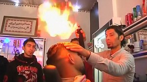 ‘Blowtorch barber’ offers flame-straightened hair styling in Gaza