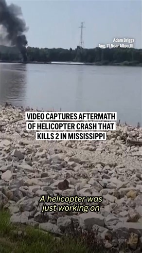A helicopter flying over the Mississippi River ran into a powerline Thursday, then crashed into a barge and sparked a fire, killing two people, officials said. | AP