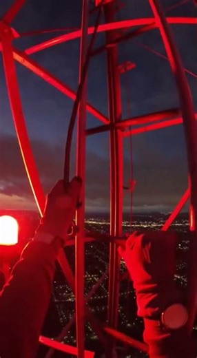 POV: Working on a tower at night
