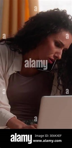 Frustrated upset Latina business woman talking mobile phone argue typing laptop Hispanic stressed businesswoman female girl at home kitchen problem browsing computer notebook smartphone call trouble Stock Video Footage - Alamy