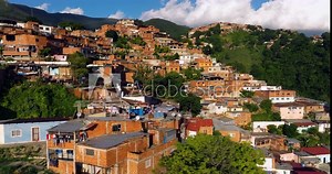 Slums (Favelas) On Hillside Near City Of Caracas In Venezuela. drone arch shot