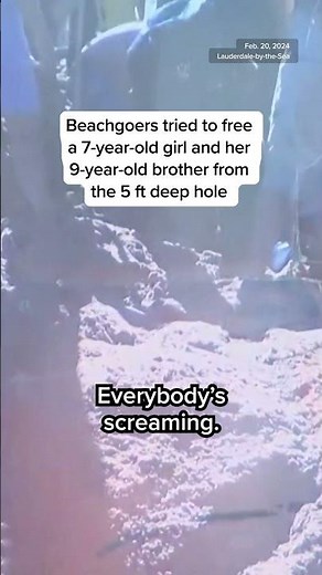 Two kids trapped in sand hole while playing on the beach