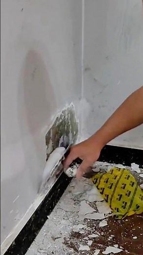 Careful Wall Plaster Repair Process to Restore Damaged Surface and Achieve a Smooth Finish