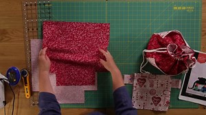 Katrina makes her own drawstring project bag using a FREE Ruby Star pattern 'Purl Project Bag'. She demonstrates the tutorial using Mandy Shaw's Say it with a Stitch fabric. 👛 Free Pattern Download here: https://my.modafabrics.com/sites/default/files/fp_psrs2029-2.pdf 👜 Say it with a Stitch Fabric Range: https://www.thesewingstudio.co.uk/fabric/say_it_with_a_stitch.irc 🎒 Ruby Star Fabric: https://www.thesewingstudio.co.uk/fabric/ruby_star_society_1.irc | The Sewing Studio UK
