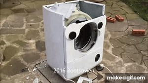 Washing machine destroyed by big brick on Make a GIF