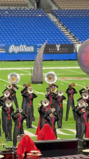 Color guard from Cedar Ridge high school marching band spinning like they could do it blindfolded. #colorguard #marchingband | Thebandmom