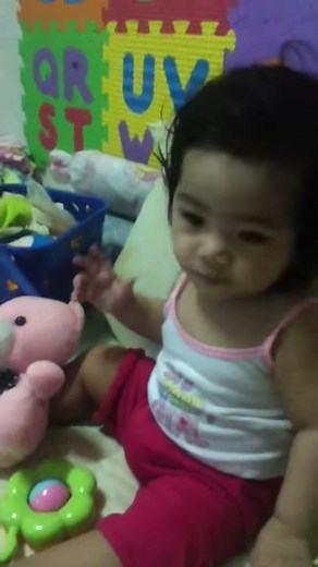 Mia enjoying brainy baby's jingle bells